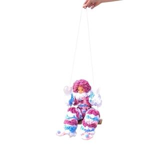 Vibrant Clown Doll on Swing
